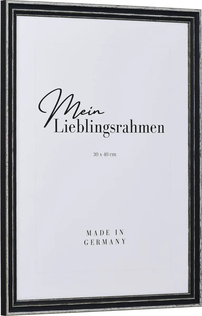 Seitenansicht eines grauen, offenporigen, Shabby Rahmens mit an den Kanten abgeriebener Farbe