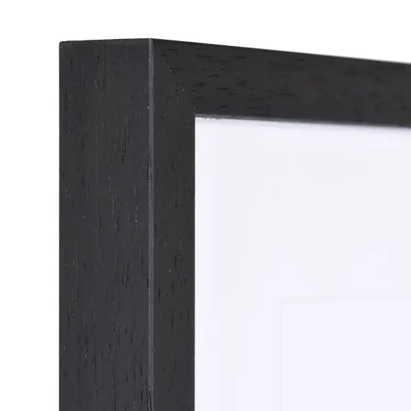 Holz-Profil 35, schwarz - Ecke Ansicht der Ecke eines modernen, schwarzen schmalen Bilderrahmens